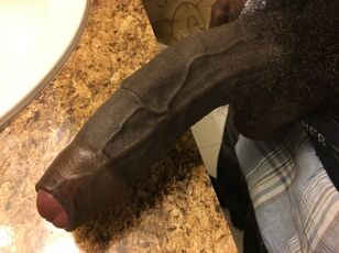 lengthy dark-hued uncircumcised