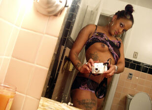 Tattoed young woman black taking